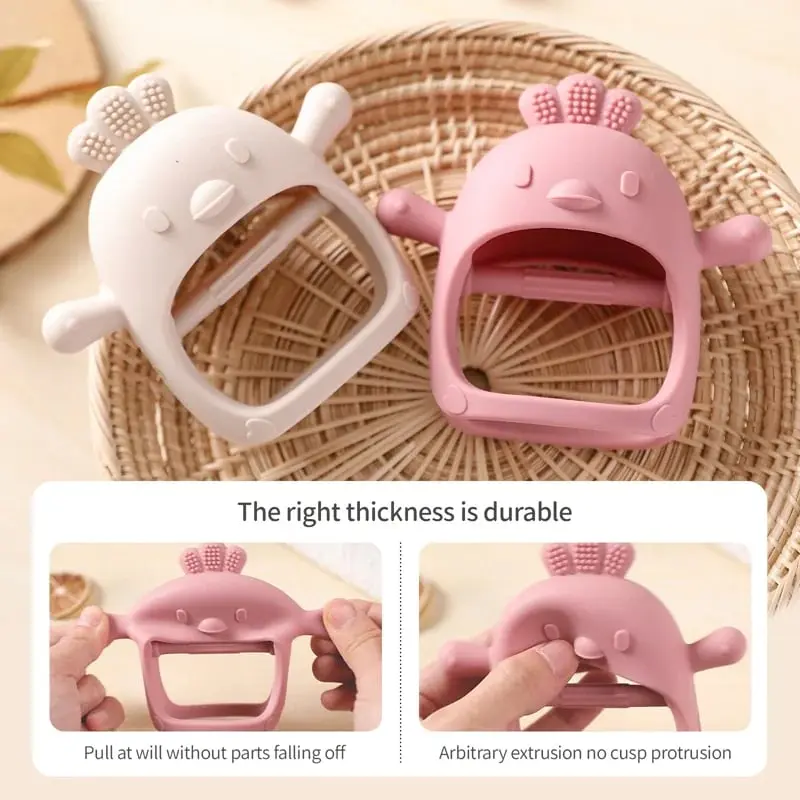 Baby holding teething glove