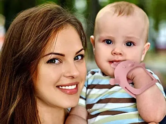 Baby with teething toy